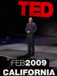 beeld uit opname TED Talk van Tim Berners-Lee, gegeven in 2009 in California.Tim op het podium.